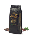 Lucaffé Mr. Exclusive 100% Arabica coffee beans 1 kg package with scattered beans and mint leaves.